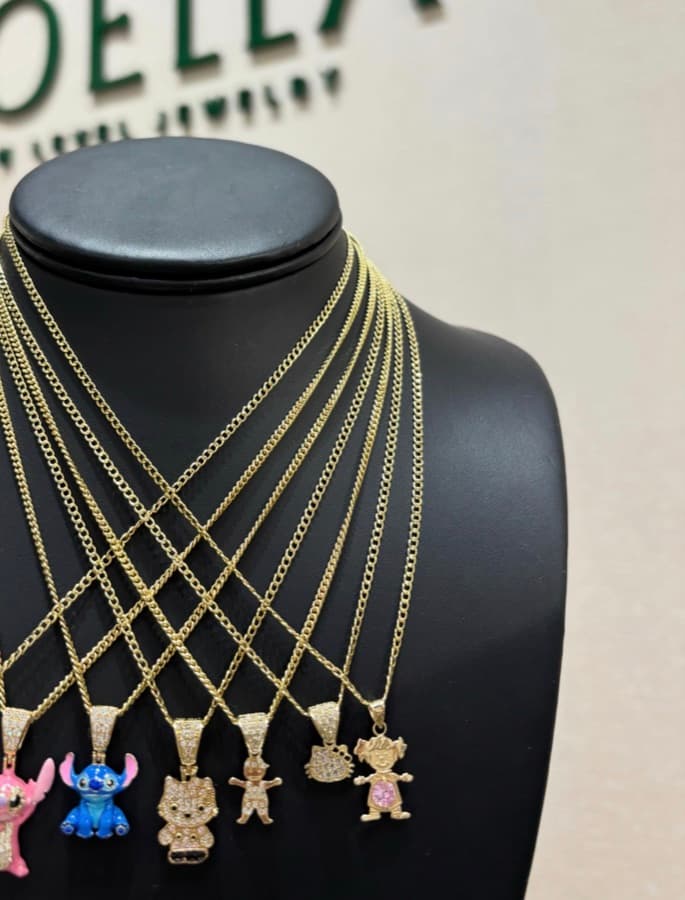 Character pendants on gold chains in the boutique