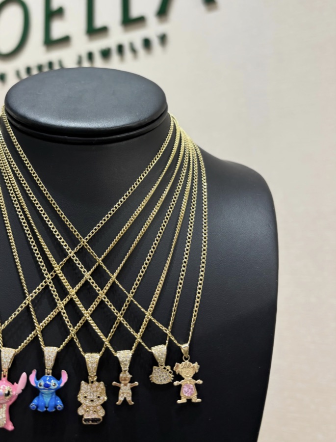 Character pendants on gold chains in the boutique